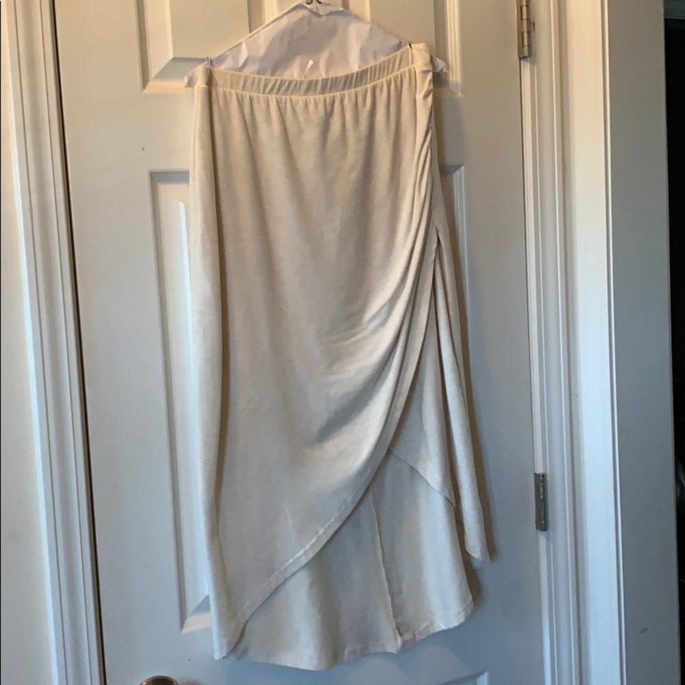 Beige skirt asymmetrical shorter in Front. Size L